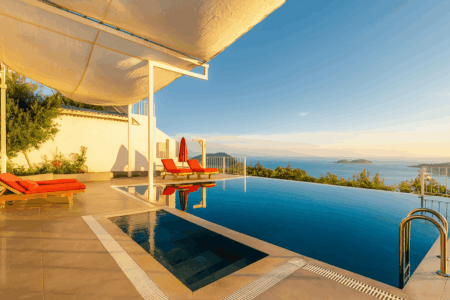 Villa Seboş – Luxury villa in Kalkan with infinity pool, children’s pool, sun loungers, and stunning Mediterranean sea view.
